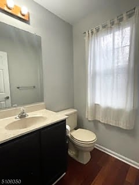 13 Andover Circle Princeton, NJ 08540 - Photo 9 of 19 a bathroom with a granite countertop sink toilet a mirror and a shower