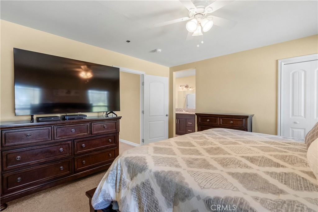 6800 Arlington Avenue Riverside, CA 92504 - Photo 13 of 25 a bedroom with a bed and a flat screen tv