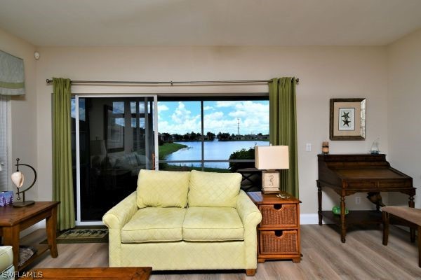 11698 Eros Road Lehigh Acres, FL 33971 - Photo 12 of 34 a living room with furniture and a large window