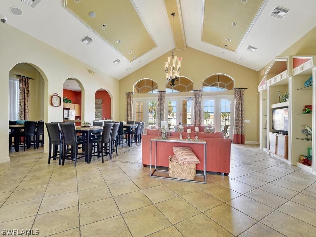 11698 Eros Road Lehigh Acres, FL 33971 - Photo 29 of 34 a view of a dining hall with lots of tables and chairs