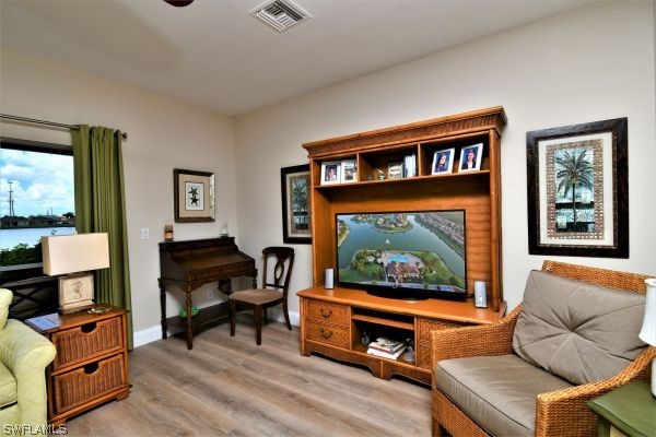 11698 Eros Road Lehigh Acres, FL 33971 - Photo 10 of 34 a living room with furniture a rug and a window