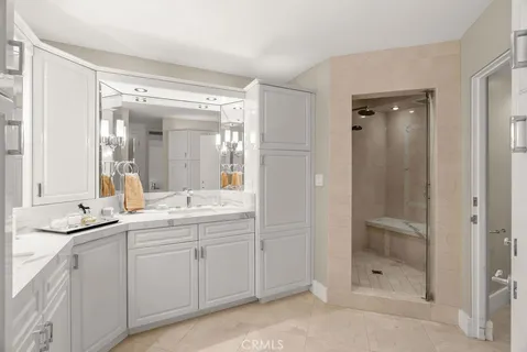 a bathroom with a shower sink and mirror