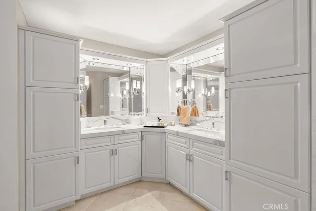 a view of a sink and mirror with window