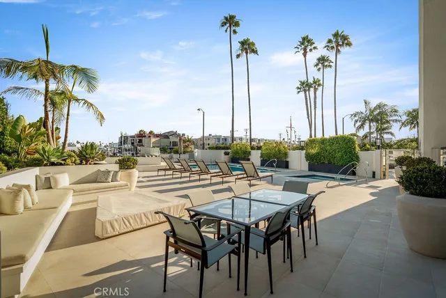 a view of a swimming pool with outdoor seating