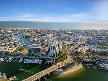 an aerial view of residential building and ocean
