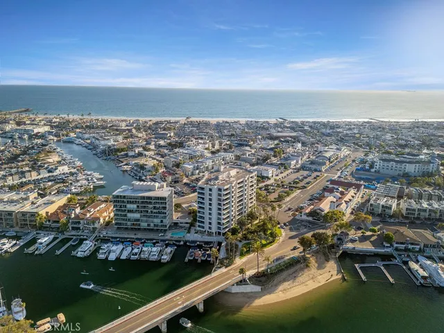 an aerial view of residential building and ocean