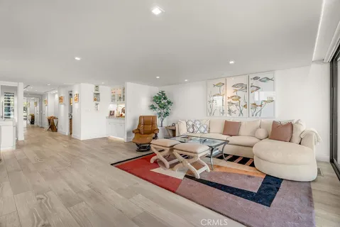 a living room with furniture or couch and a wooden floor