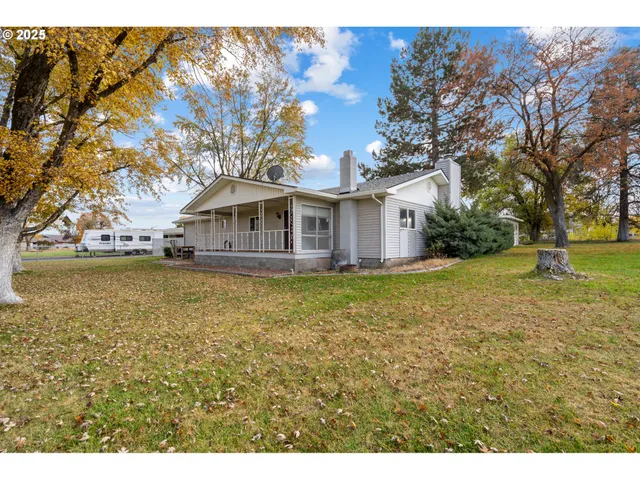 an aerial view of a house with a ocean view