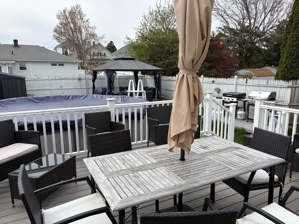 231 Lapham Street Fall River, MA 02721 - Photo 6 of 20 a view of a dinning table and chairs in patio