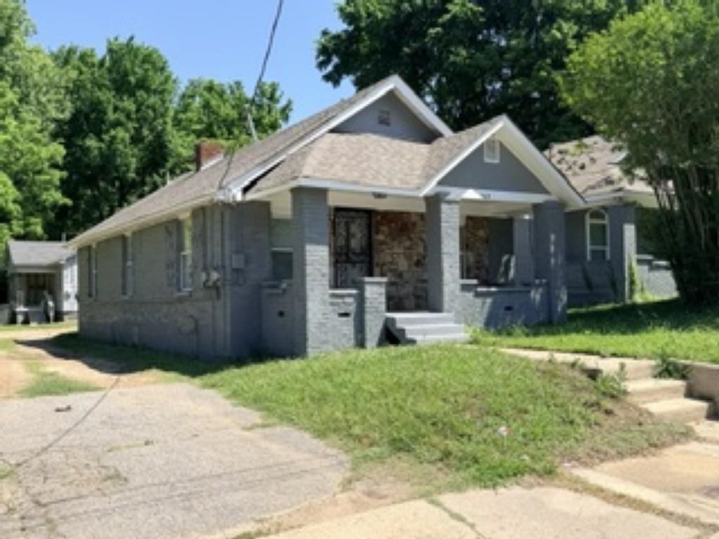 564 West Peebles Road Memphis, TN 38109 - Photo 1 of 11 a front view of a house with a yard
