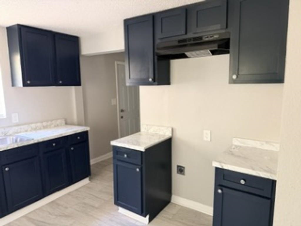 564 West Peebles Road Memphis, TN 38109 - Photo 6 of 11 a utility room with cabinets