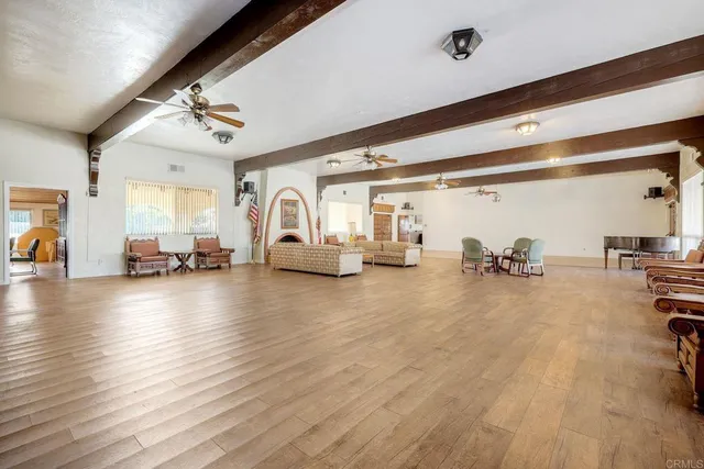 a living room with furniture and pool table
