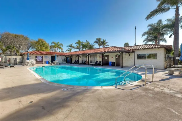 a view of a kitchen with furniture and wooden floor
