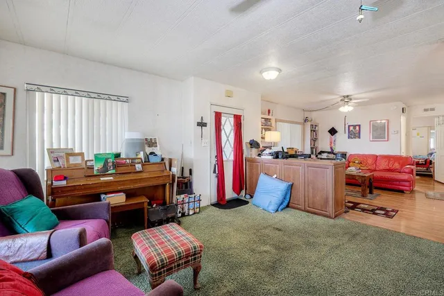a work place with kitchen island a table and chairs in it