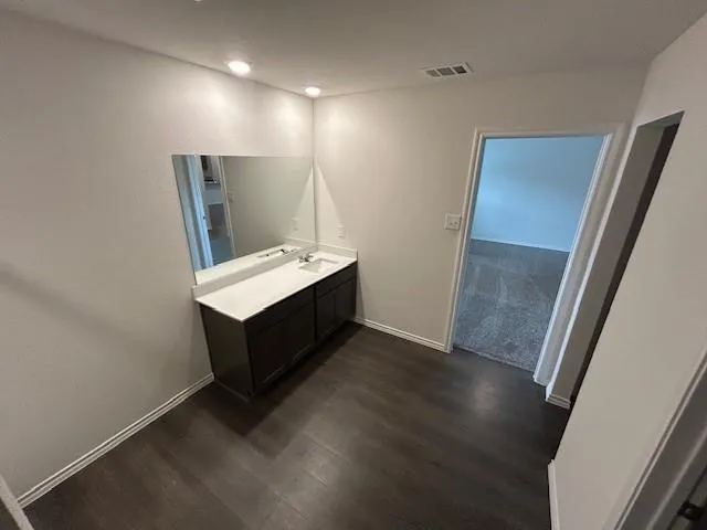 a room with furniture and a wooden floor