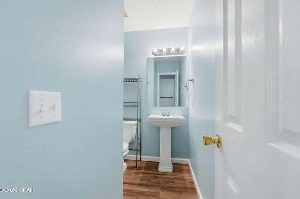 a view of hall way with mirror