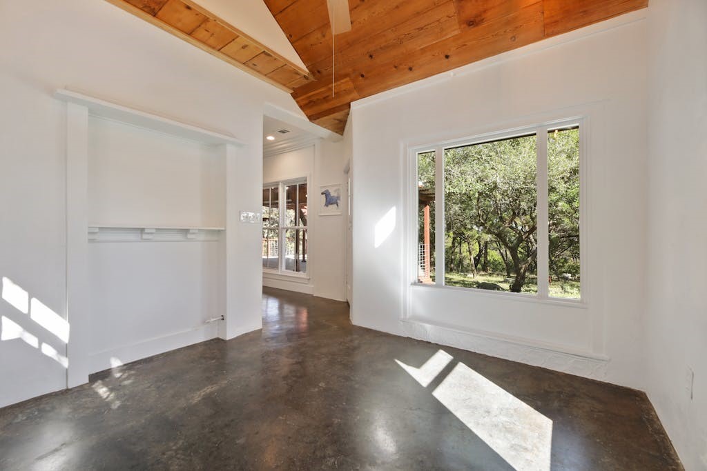 1612 The High Road Austin, TX 78746 - Photo 15 of 26 a view of an empty room with a window