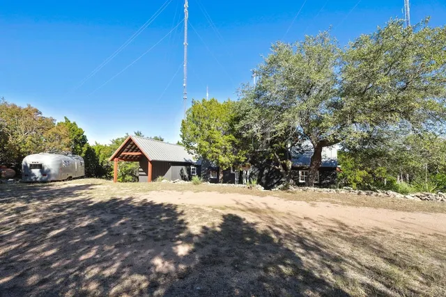 a view of a house with a snow in the yard