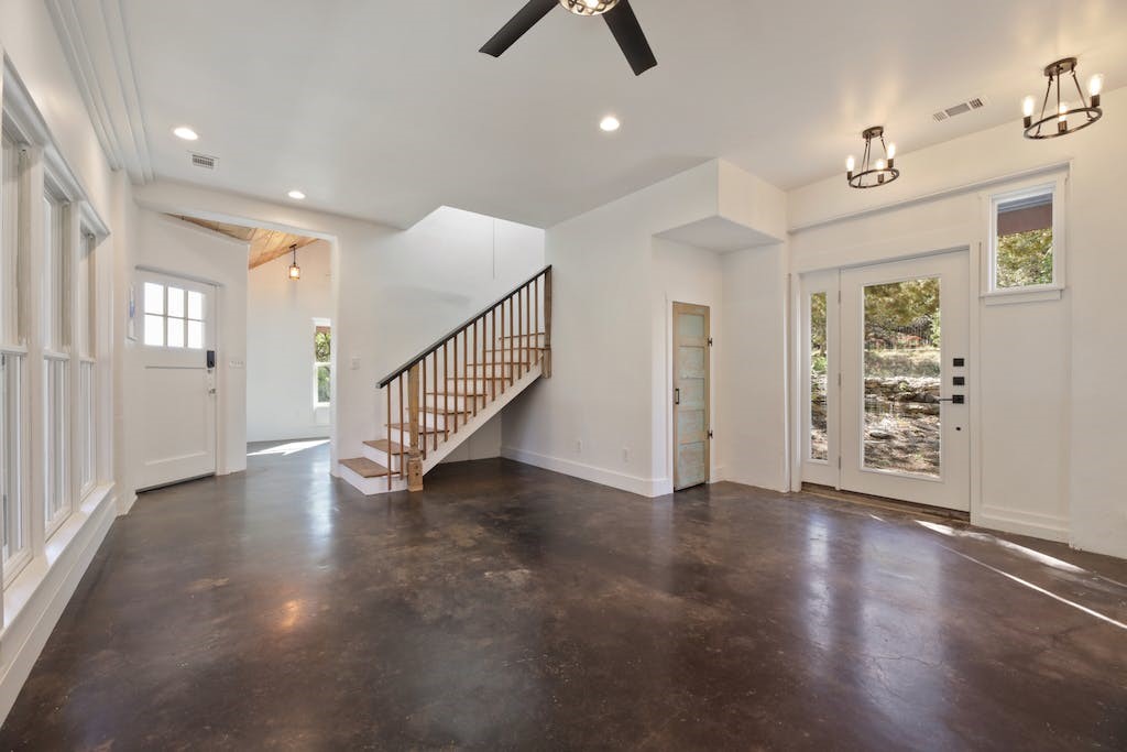 1612 The High Road Austin, TX 78746 - Photo 8 of 26 an empty room with wooden floor and ceiling fan