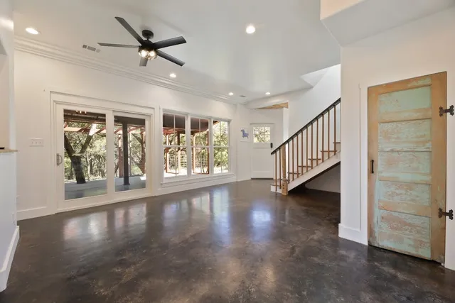 a view of an entryway with wooden floor