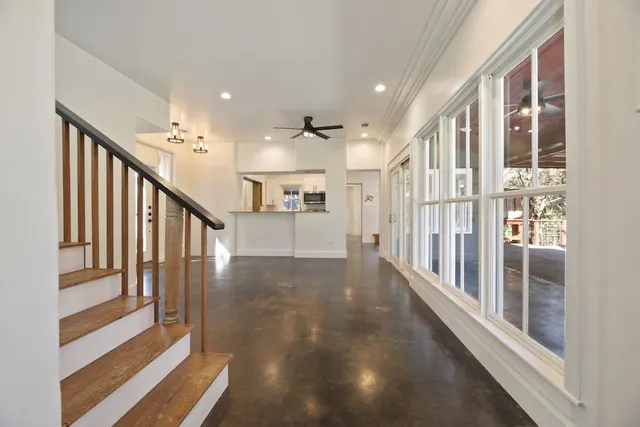 a view of entryway and hall with wooden floor