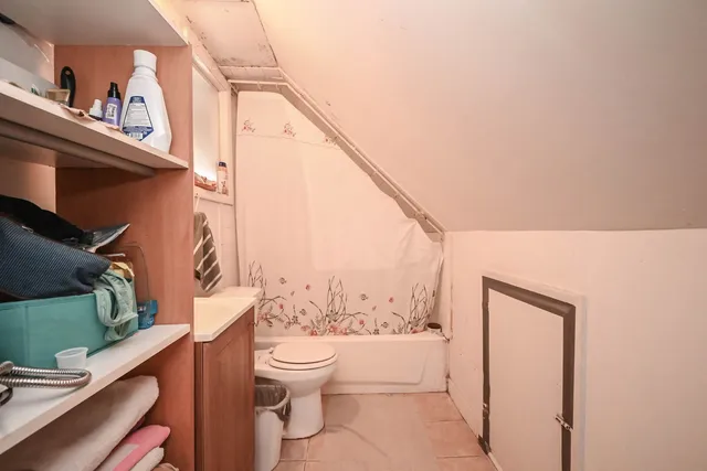 a white toilet sitting next to a bathroom sink