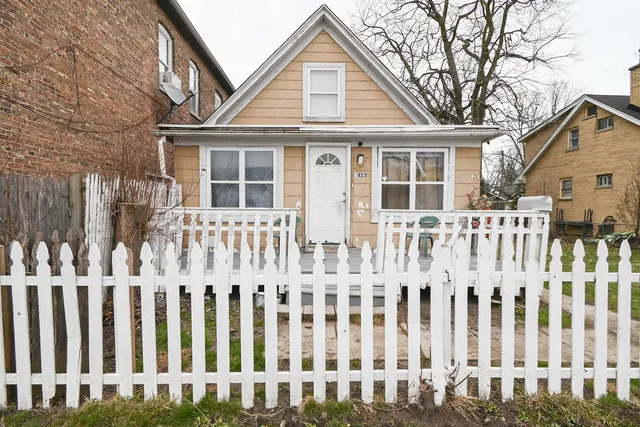 a front view of a house with a small yard