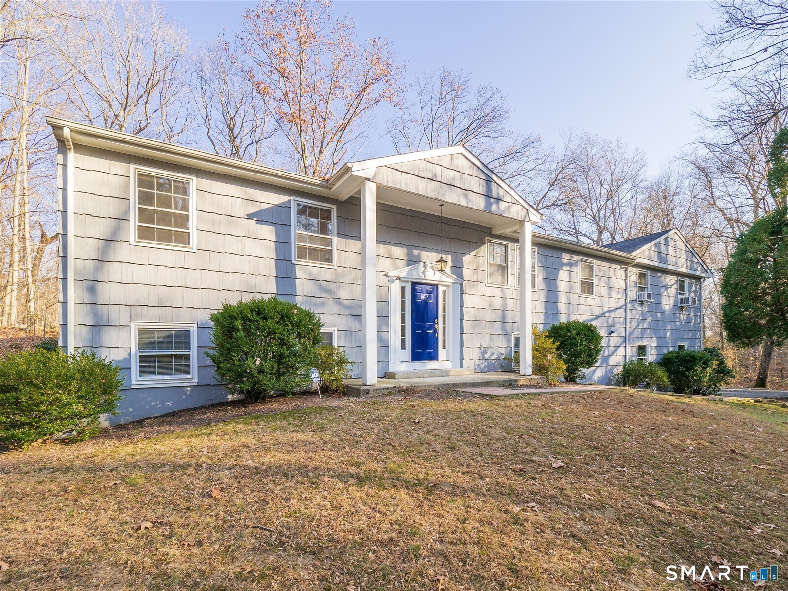 267 Thayer Pond Road Wilton, CT 06897 - Photo 1 of 28 a view of a house with a yard and potted plants