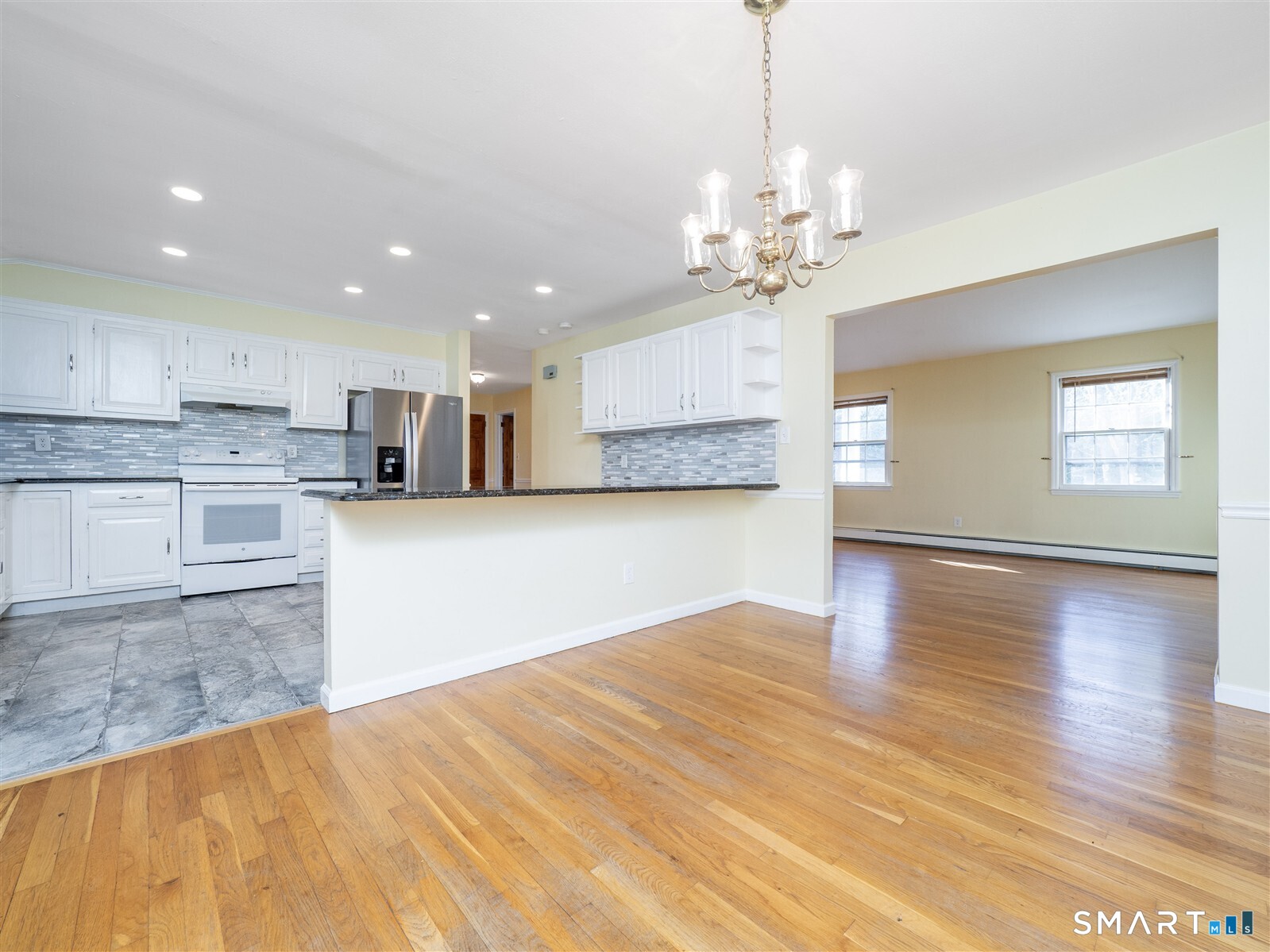 267 Thayer Pond Road Wilton, CT 06897 - Photo 11 of 28 a view of kitchen with granite countertop cabinets and wooden floor