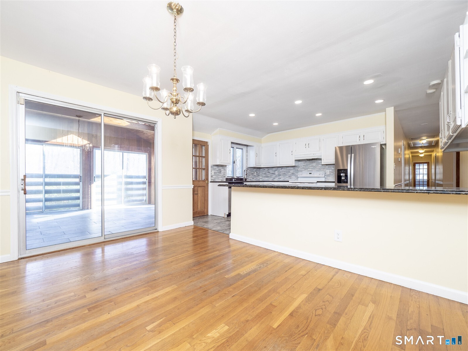 267 Thayer Pond Road Wilton, CT 06897 - Photo 12 of 28 a view of a kitchen with wooden floor and a kitchen