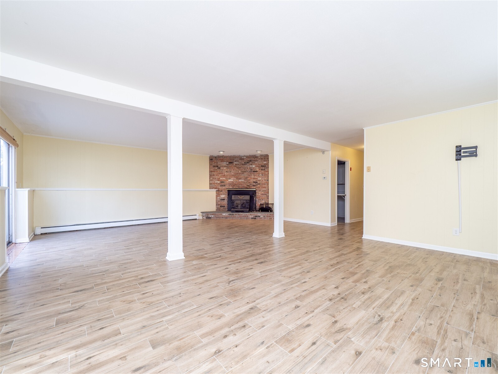 267 Thayer Pond Road Wilton, CT 06897 - Photo 21 of 28 a view of empty room with wooden floor