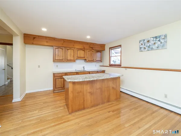 a view of kitchen with wooden floor