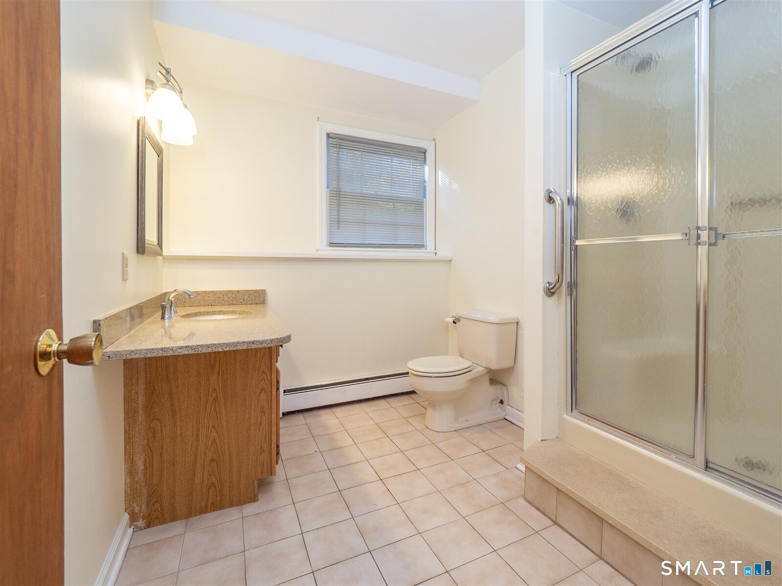 267 Thayer Pond Road Wilton, CT 06897 - Photo 28 of 28 a bathroom with a toilet sink and shower