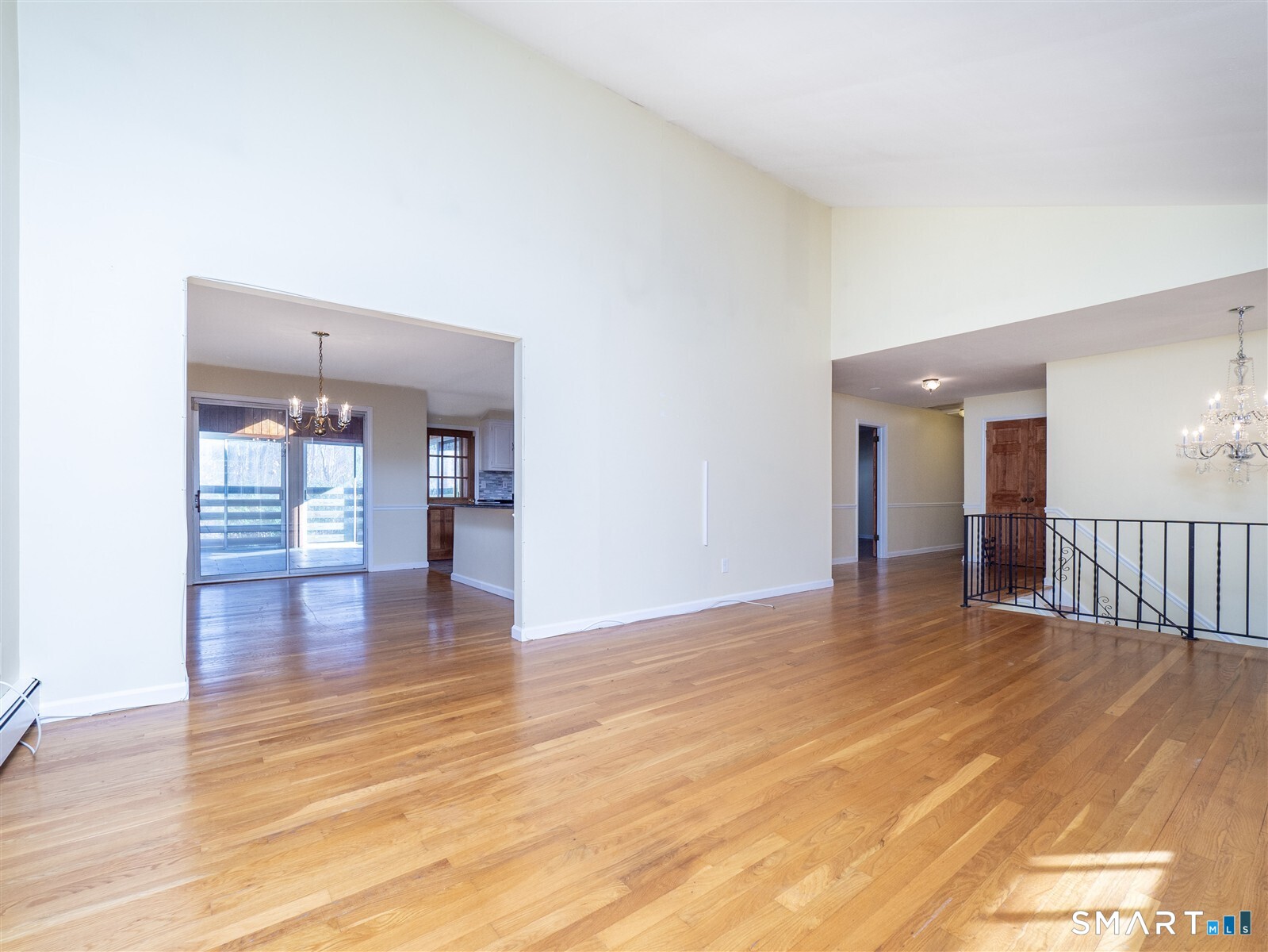 267 Thayer Pond Road Wilton, CT 06897 - Photo 8 of 28 a view of empty room with wooden floor