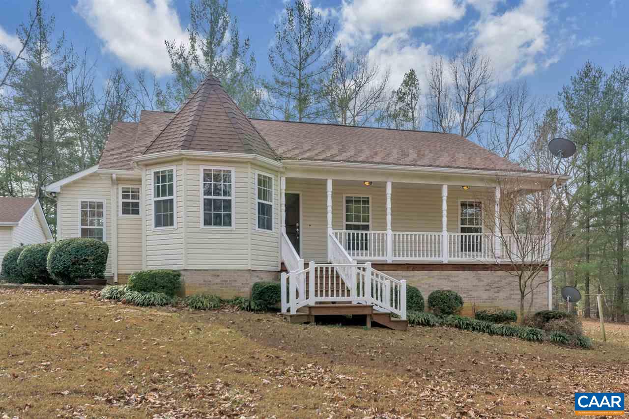 380 Chapel Road Ruckersville, VA 22968 - Photo 1 of 25 a front view of a house with a yard and garage