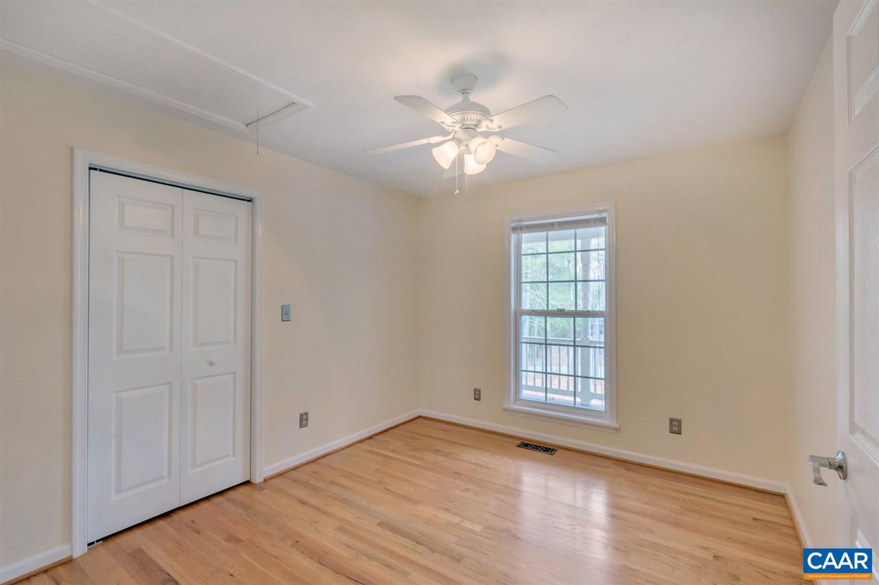 380 Chapel Road Ruckersville, VA 22968 - Photo 13 of 25 a view of empty room with wooden floor and fan