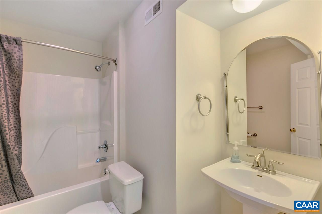 380 Chapel Road Ruckersville, VA 22968 - Photo 21 of 25 a bathroom with a sink toilet and shower