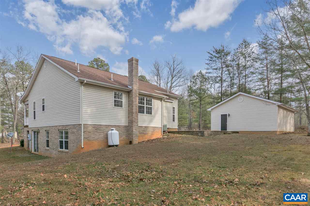 380 Chapel Road Ruckersville, VA 22968 - Photo 23 of 25 a view of a house with a yard and large tree
