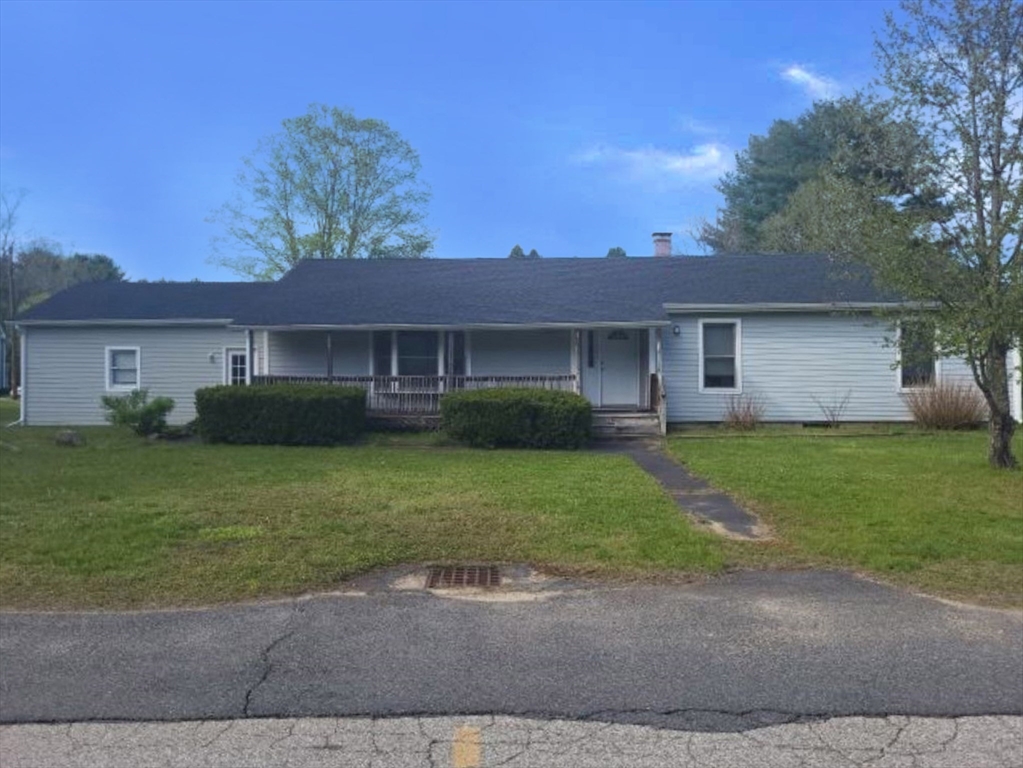 39 Ruggles Street Gilbertville, MA 01031 - Photo 1 of 14 a front view of a house with a garden