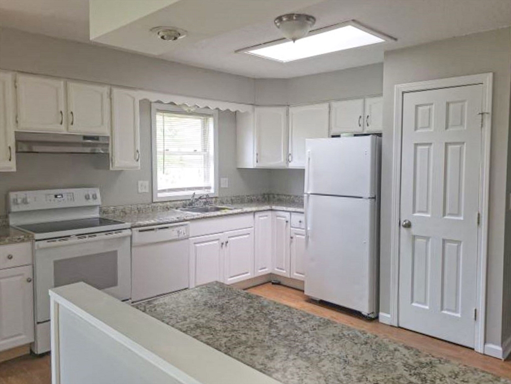39 Ruggles Street Gilbertville, MA 01031 - Photo 2 of 14 a kitchen with granite countertop cabinets appliances and a counter space