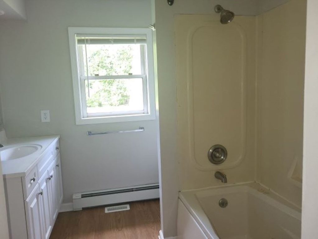 39 Ruggles Street Gilbertville, MA 01031 - Photo 7 of 14 a bathroom with a sink a toilet and shower