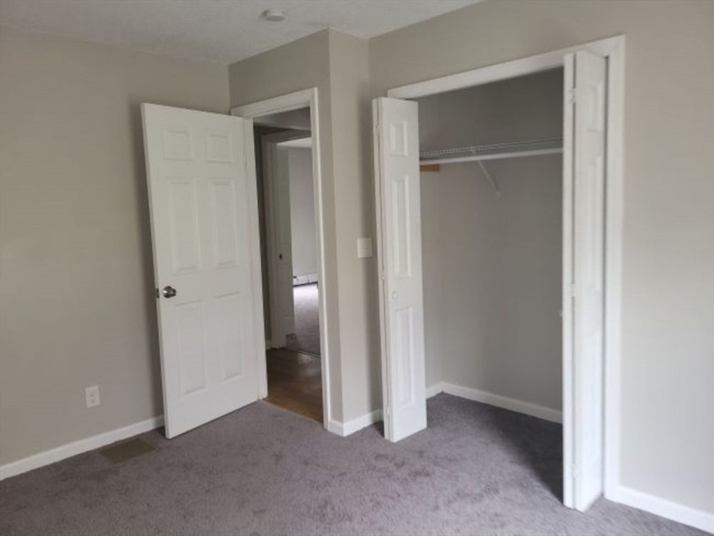 39 Ruggles Street Gilbertville, MA 01031 - Photo 9 of 14 a view of an empty room with closet area