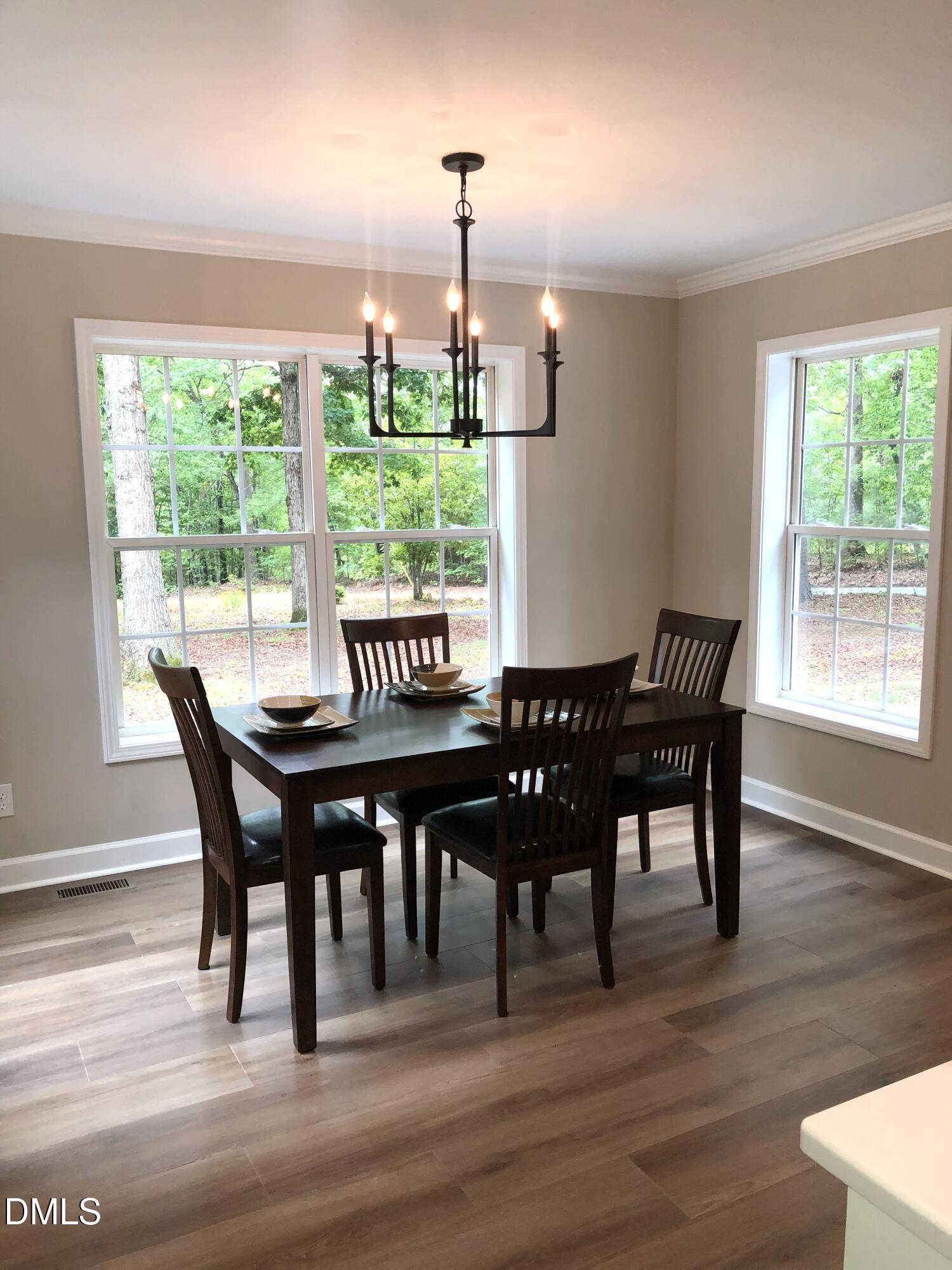 95 Smith Taylor Trail Roxboro, NC 27574 - Photo 30 of 47 a view of a dining room with furniture window and wooden floor