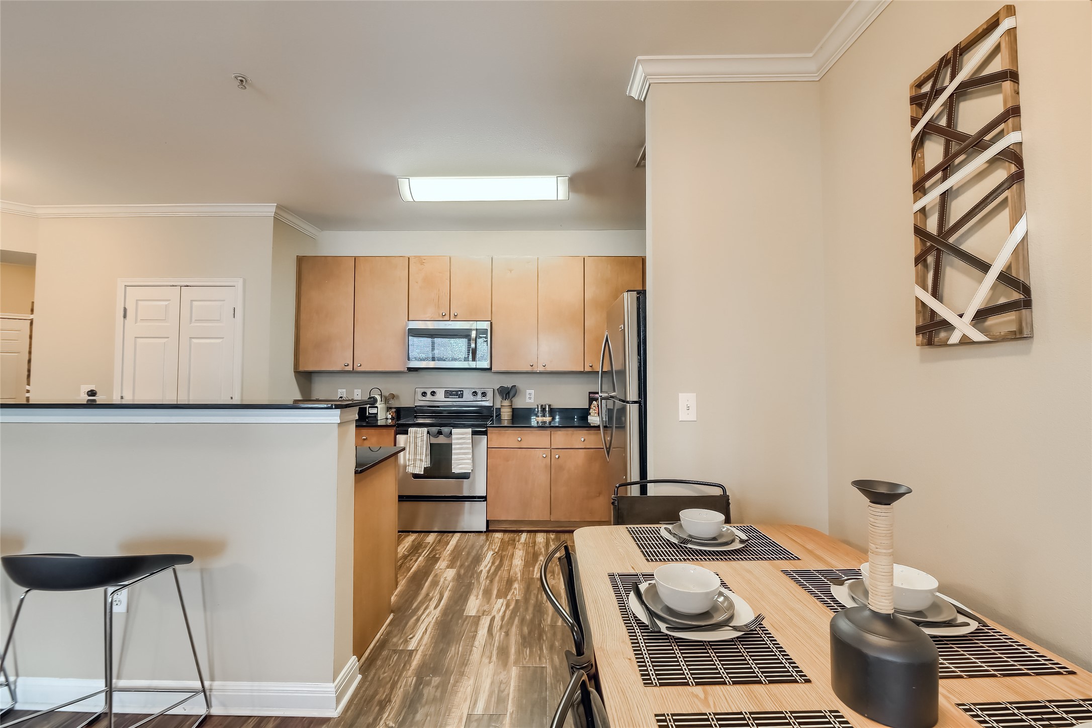 2502 Leon Street, Unit 212 Austin, TX 78705 - Photo 14 of 35 Its open placement keeps the space connected to both the kitchen and living room.