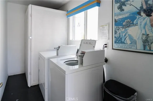 a kitchen with a sink and a refrigerator