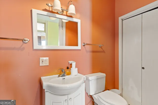 a kitchen with a sink a stove and refrigerator