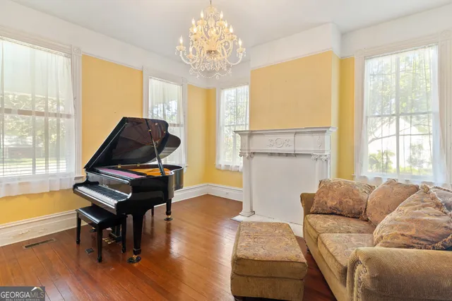 a living room with furniture and a flat screen tv