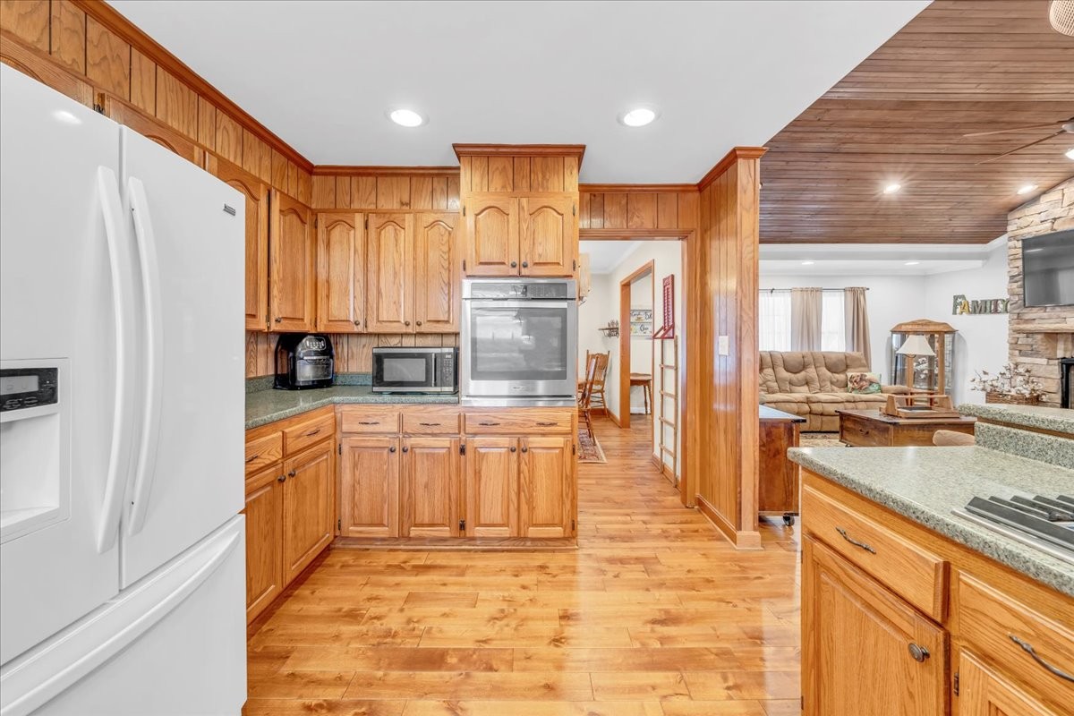 675 Bible Crossing Road Winchester, TN 37398 - Photo 16 of 35 a large kitchen with granite countertop a large counter top stainless steel appliances and cabinets