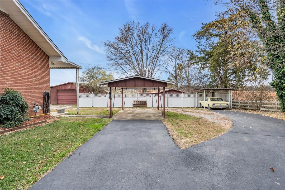 675 Bible Crossing Road Winchester, TN 37398 - Photo 3 of 35 a front view of a house with a yard and garage