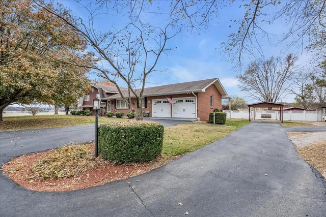 front view of a building with a garden